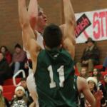 Gabe Wynn rises above Vashon Island&rsquo;s Jahmiah Hoogen for a shot. (Photo by Jim Waller)