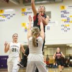 Coupeville&rsquo;s Makana Stone, shown here scoring in the regional basketball tournament, graduated as one of the most celebrated athletes in school history. (Photo by John Fisken)