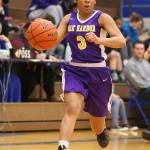 Rashanna Graham races up the court to get the offense started. (Photo by John Fisken)