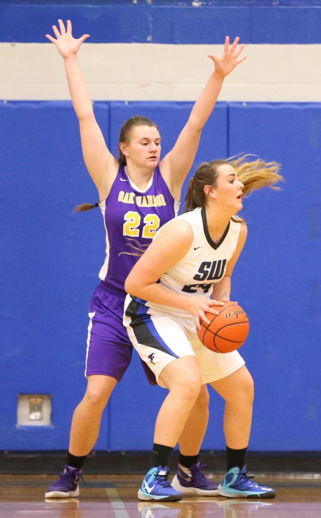 Julie Jansen guards South Whidbey&rsquo;s Mackenzee Collins. (Photo by John Fisken)