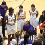 Oak Harbor head coach Jon Atkins, center, talks to his team during a break in the action. (Photo by John Fisken)