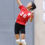 Carly Mosley serves for the North Whidbey seventh-graders. (Photo by John Fisken)