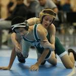 Shamus Warden, top, works to break down his opponent Saturday. (Photo by John Fisken)