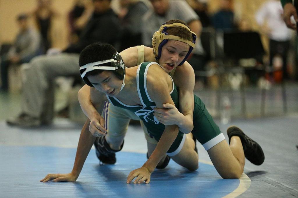 Shamus Warden, top, works to break down his opponent Saturday. (Photo by John Fisken)