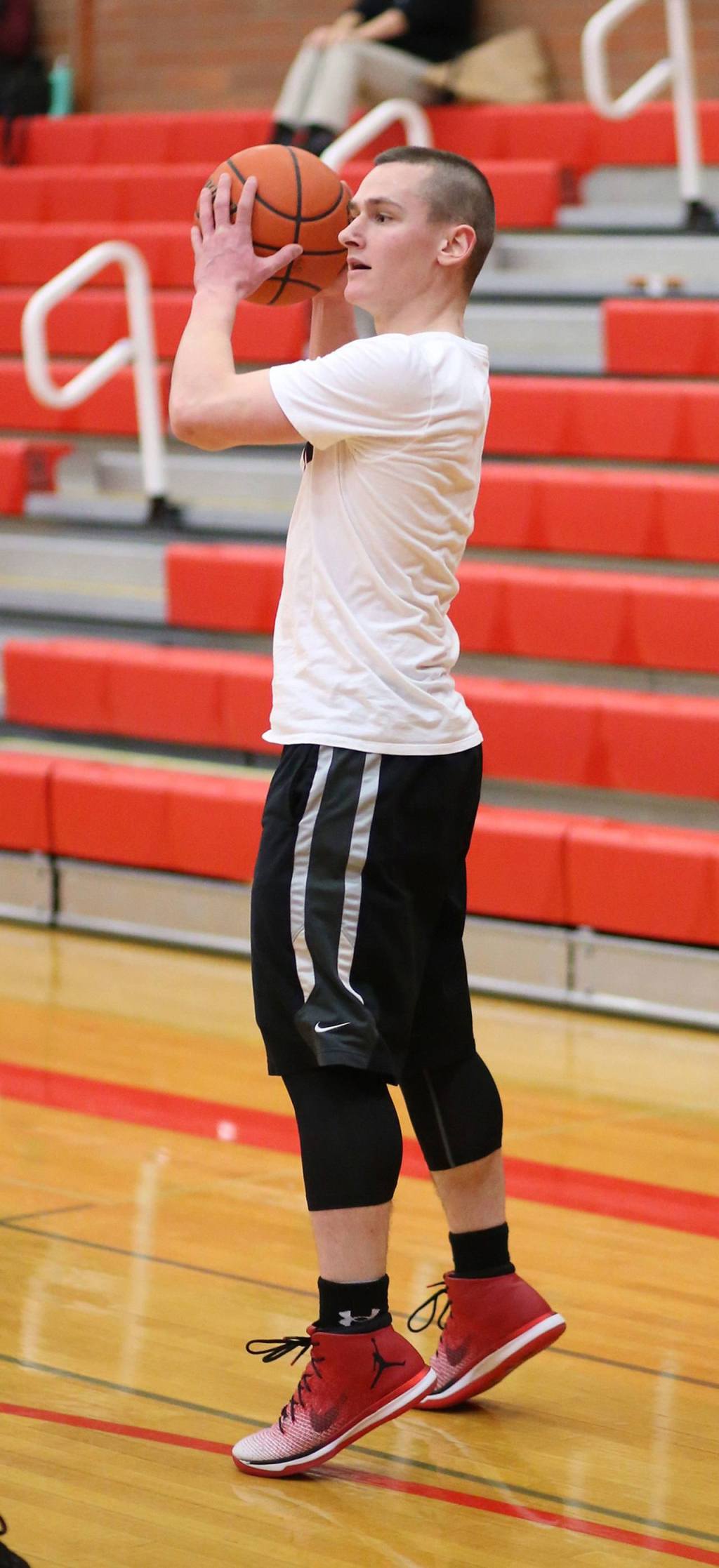 Former Coupeville star Gavin O&rsquo;Keefe examines the defense. (Photo by John Fisken)