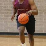 Kevawn Brooks bring the ball up the floor at the Roehl Tournament. (Photo by John Fisken)
