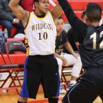 OHHS freshman boys basketball coach Matt Nuqui looks inside for an open teammate. (Photo by John Fisken)