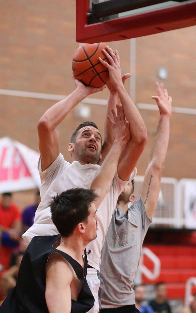 Scott Stuurmans, a former standout for Coupeville, muscles to the basket. (Photo by John Fisken)