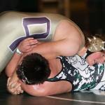 Wildcat Sam Zook records a pin in the season opener Thursday. (Photo by John Fisken)