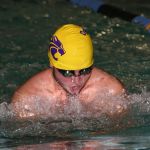 Kenneth Morrow competes in the breaststroke for the Wildcats Monday. (Photo by John Fisken)