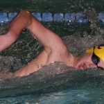 Freshman Bruce Vagt pulls his way to first place in the 400 freestyle. (Photo by John Fisken)