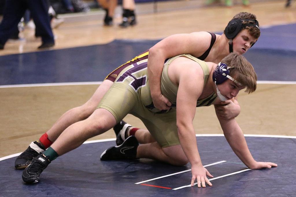 Oak Harbor&rsquo;s Abe Coleman, bottom, works to escape Saturday. (Photo by John Fisken)