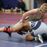Lucas Nickelson, top, tangles at the Storm Duals. (Photo by John Fisken)