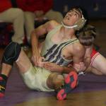 Oak Harbor&rsquo;s Caleb Fitzgerald, front, tries to escape the hold of his M-P opponent. (Photo by John Fisken)