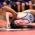Zion Gomez looks to the bench for instructions from his coach. (Photo by John Fisken)