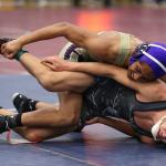 Zion Gomez, top, takes control of his match Tuesday. (Photo by John Fisken)