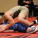 Shingo Johnston, top, looks to take control against his Sultan opponent. (Photo by John Fisken)