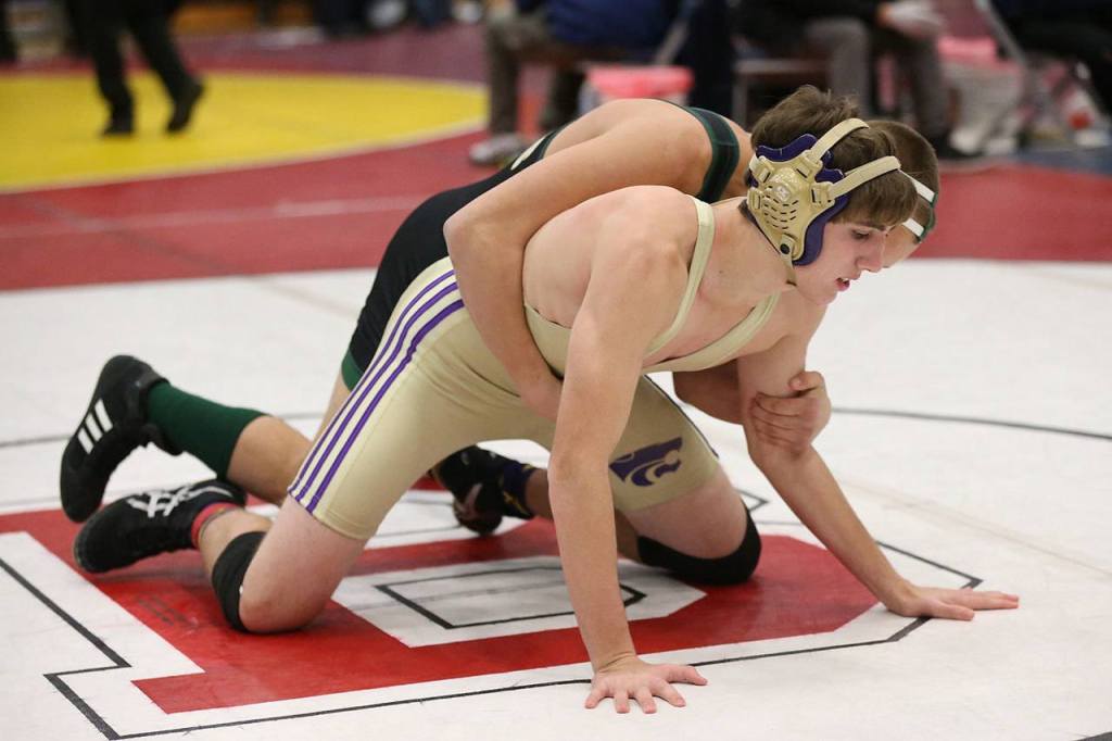 Wildcat Ethan Pace, front, takes on Sehome&rsquo;s Andy Waters. (Photo by John Fisken)