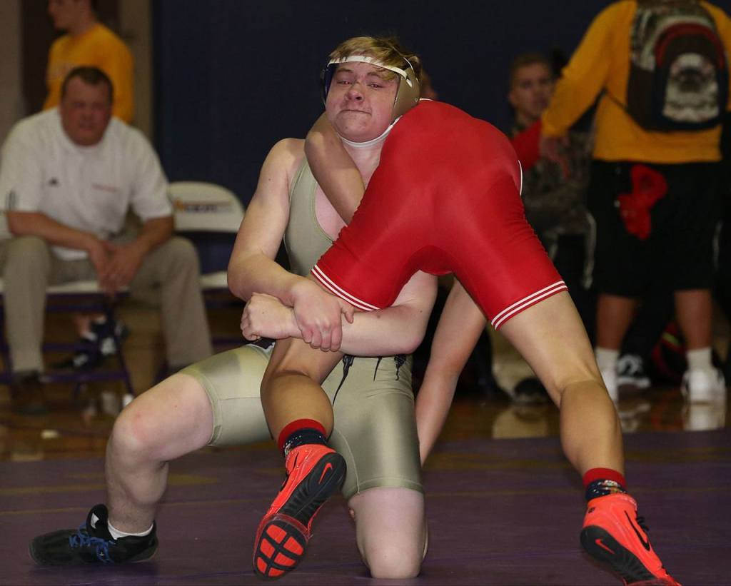 Wildcat Trevor Vaughn, left, tries to record a takedown Thursday. (Photo by John Fisken)