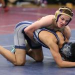 Wildcat Shamus Warden, top, tries to break down his opponent. (Photo by John Fisken)