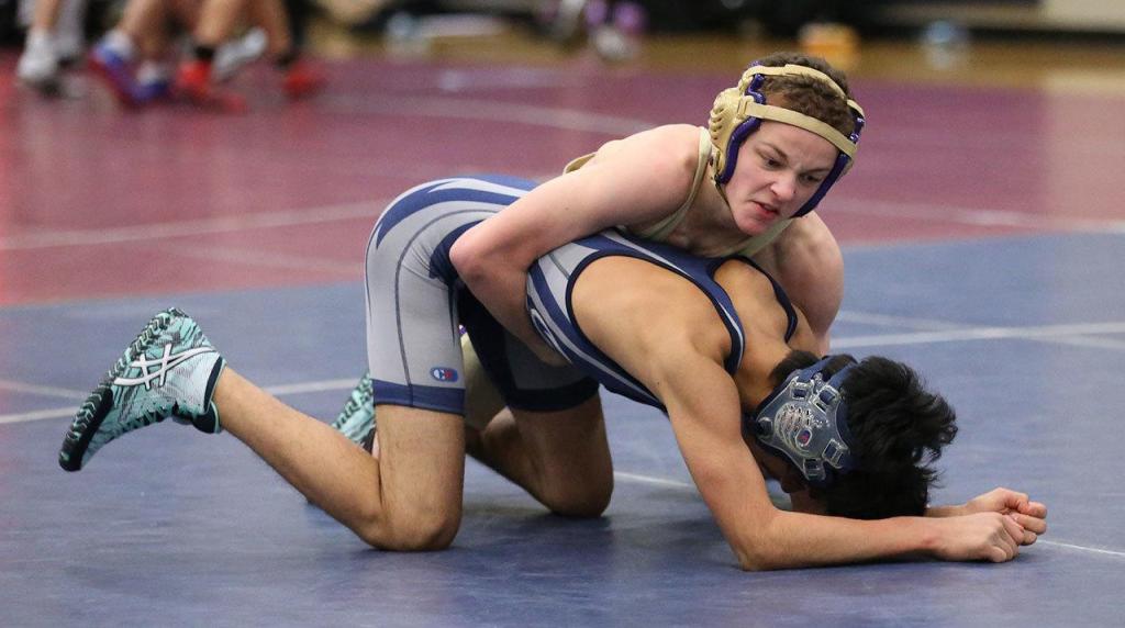 Wildcat Shamus Warden, top, tries to break down his opponent. (Photo by John Fisken)