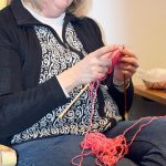 Pam Muncey leads a circle of knitters at Langley&rsquo;s Knitty Purls. Hundreds of hats for the Jan. 21 women&rsquo;s marches in many cities have been made around Whidbey in the past month. Stores often ran out of pink yarn and needles.                                Photo by Patricia Guthrie/Whidbey News-Times
