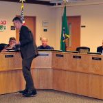 Photo by Michael Watkins/Whidbey News-Times                                Oak Harbor Public Schools Superintendent Lance Gibbon presents letters of appreciation to school board members Monday in Oak Harbor. January is School Board Recognition Month.