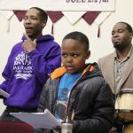 Darreyl Boyles, 9, sings with his father, Charles Boyles III (in front of drums) and Tyrone Vester at practice for the United Fellowship Community Church choir. They will perform 3 p.m. Sunday at the House of Prayer in Oak Harbor at an annual event honoring Martin Luther King, Jr.                                Photo by Patricia Guthrie/Whidbey News-Times