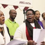 Photo by Patricia Guthrie/Whidbey News-Times                                The United Fellowship Community Choir warms up for Martin Luther King, Jr. celebrations at House of Prayer in Oak Harbor. The group performed Friday at Naval Air Station Whidbey Island and will be part of a Sunday service. Singing in the front row are Genia Boyles, left, and Loretta Byrd. Kahnvis Gordon (left) Tyrone Vester (middle) and Charles Boyles III are in the back row.