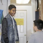 Immanuel McLaurin interacts with a youth at the boys and girls club last week. McLaurin started as a member at the club at the age of 8 and eventually became part of the paid staff.