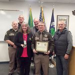 From left: Chief Criminal Deputy Rick Felici, Coupeville Marshall Chris Garden, Lou Ann Miller, Sheriff Mark Brown, Deputy Bo Miller and Larry Vail. Miller recieved a life-saving medal Tuesday for his actions Nov. 3 when Vail had a cardiac incident while on a ladder and fell. Photo provided