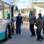 Photo by Michael Watkins/Whidbey News Times                                An Island Transit bus picks up passengers Tuesday in Oak Harbor.