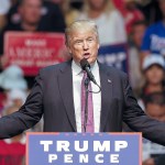 Andy Bronson / The Herald                                Donald Trump speaks to a nearly full arena of supporters during a pre-election rally at Everett&rsquo;s Xfinity Arena Aug. 30.