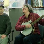 Time Together Program Director Mel Watson (right) leads Gary Dronen and the rest of the program group in a sing-along of &ldquo;You Are My Sunshine.&rdquo; Photo by Kyle Jensen/Whidbey News Group