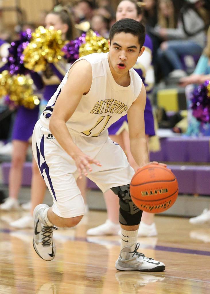 Ty Baker looks to attack the hoop. (Photo by John Fisken)