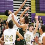 Justin Ellison rejects a shot by Shorecrest&rsquo;s Malcolm Rosier-Butler. (Photo by John Fisken)