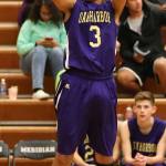 Justin Ellison fires up a jumper for the Wildcats. (Photo by John Fisken)