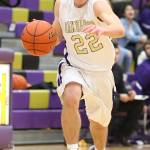 JJ Mitchell hustles the ball up the court during a Wildcat fastbreak. (Photo by John Fisken)