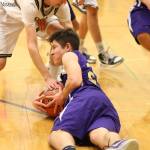 JJ Mitchell scrambles to control a loose ball. Mitchell was praised by coach John Weston for his effort in the game. (Photo by John Fisken)