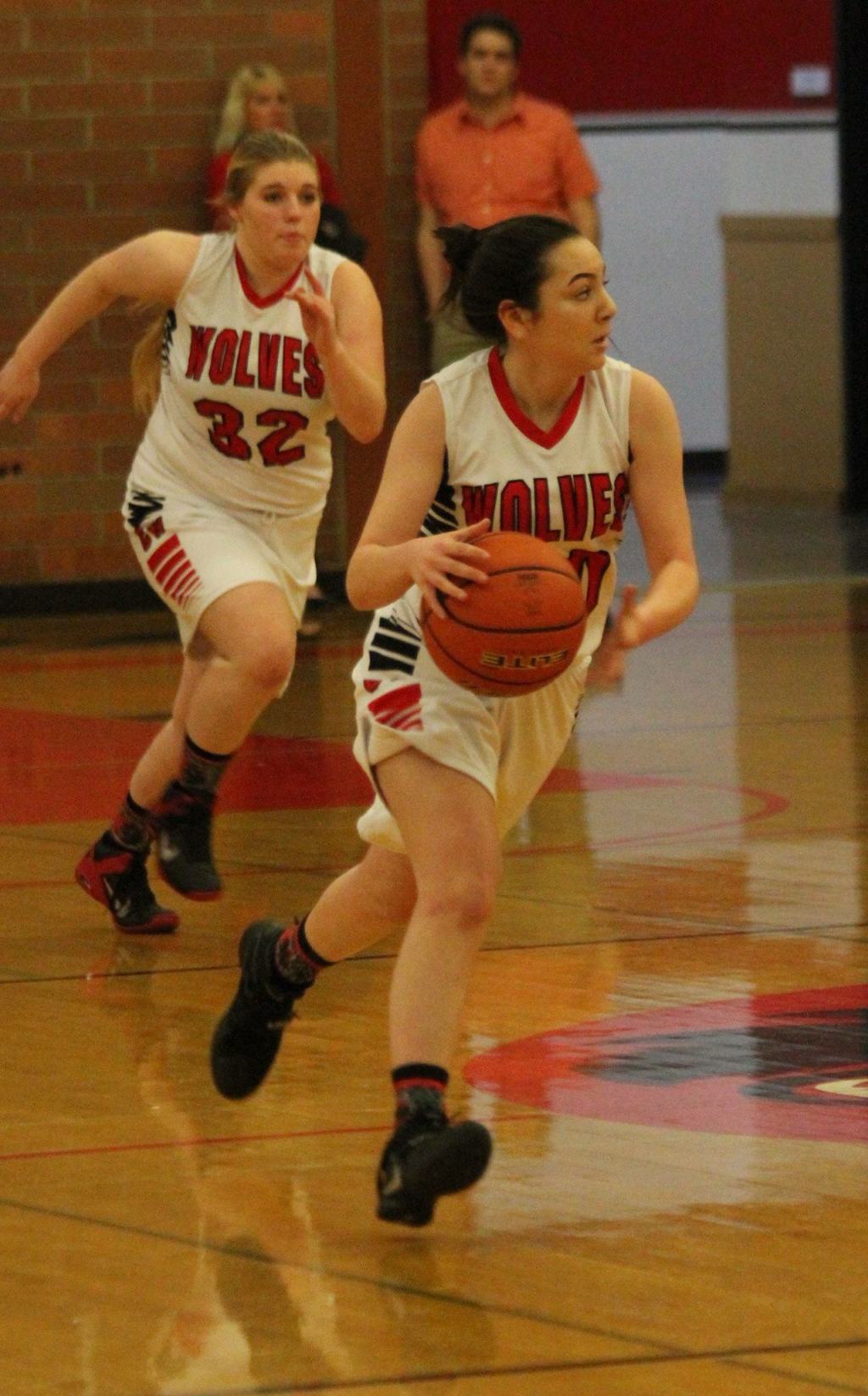 Coupeville&rsquo;s Kalia Littlejohn leads a fast break after a steal as Tiffany Briscoe hustles to fill a lane. (Photo by Jim Waller/Whidbey News-Times)