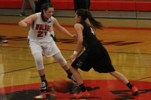 Wolves lock up third straight title / Girls basketball