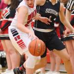 Mia Littlejohn slips by Sequim&rsquo;s Hope Glasser in Monday&rsquo;s win. Littlejohn&rsquo;s strong all-around game helped the Wolves claim the non-league victory. (Photo by John Fisken)
