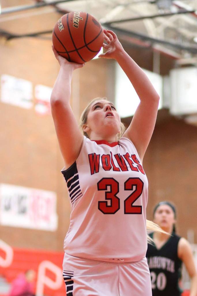 Tiffany Briscoe scores in the win over Klahowya Saturday. (Photo by John Fisken)