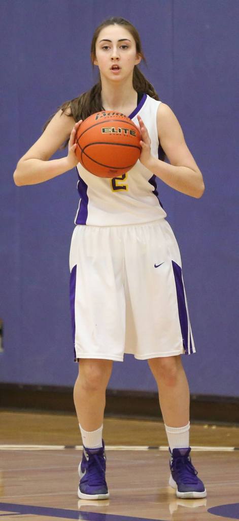 Emily Gouge looks to pass for the Wildcats. (Photo by John Fisken)