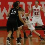 Lauren Grove defends Klahowya&rsquo;s Amber Bumbalough as Kailey Kellner (42) waits to help. (Photo by Jim Waller/Whidbey News-Times)