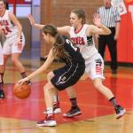 Coupeville&rsquo;s Lauren Grove slows down Sequim&rsquo;s Jessica Dietzman. (Photo by John Fisken)