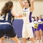 Samantha Hines looks to pass over Arlington&rsquo;s Maciee Delaney. (Photo by John Fisken)