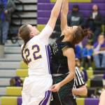 Oak Harbor&rsquo;s Julie Jansen, left, challenge&rsquo;s MG&rsquo;s Oshinaye Taylor on the opening tip. (Photo by John Fisken)