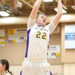Julie Jansen hauls down a rebound for Oak Harbor Friday. (Photo by John Fisken)