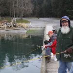 Lee Smith, right, shares a light moment with longtime fishing buddies Dean Bannister, center, and Rick Rumpff while jigging for surf smelt at Cornet Bay Wednesday, Jan. 25, 2017. Photo by Ron Newberry/Whidbey News-Times